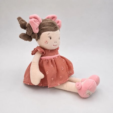Laleczka Clara BUKOWSKI 30 cm z różowymi kokardkami we włosach