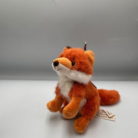 Zbliżenie na puszystego breloka w kształcie lisa Bukowski Clever Fox.